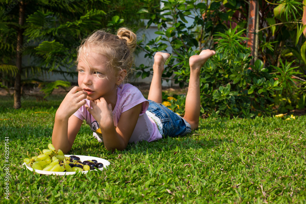 Girl eating healthy food in nature Girl eating healthy food in nature