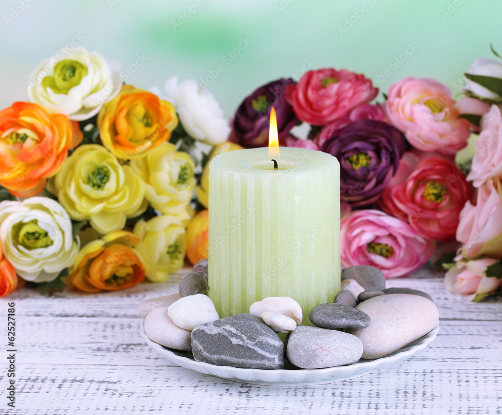 Composition with spa stones, candle and flowers Composition with spa stones, candle and flowers