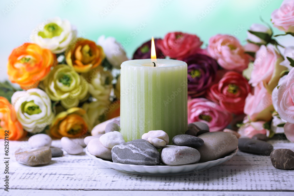 Composition with spa stones, candle and flowers Composition with spa stones, candle and flowers