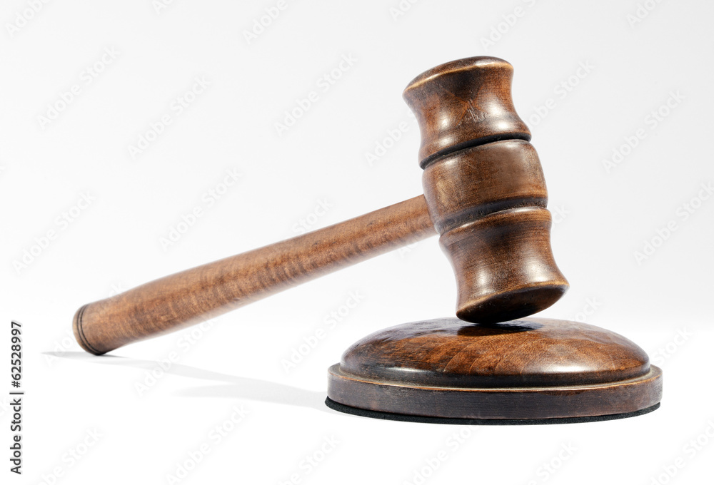 Wooden gavel as used by a judge or auctioneer Wooden gavel as used by a judge or auctioneer