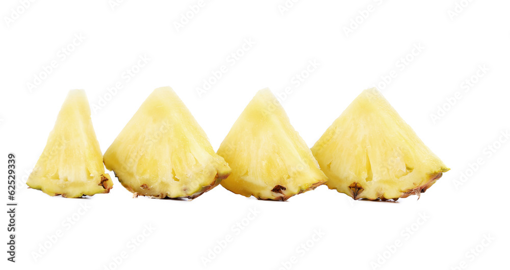 Quarters of slices pineapple in a row.