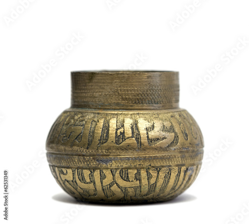 african style golden container over white