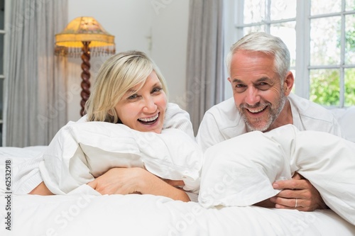 Portrait of a happy mature couple in bed © lightwavemedia