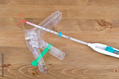 Speculum and an IUD