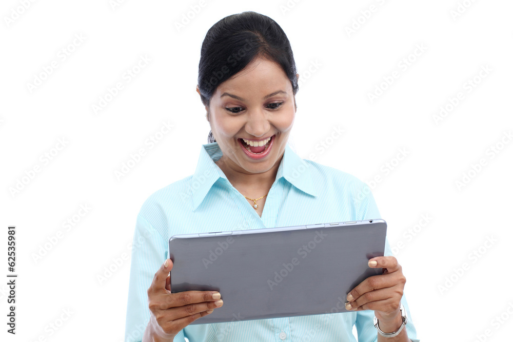 Young business woman looking at touch pad PC Young business woman looking at touch pad PC