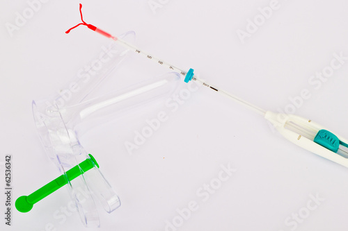 Speculum and an IUD