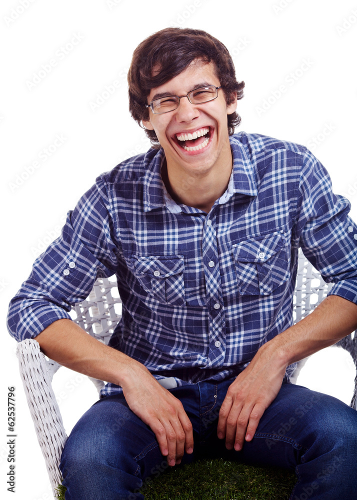 Laughing guy on chair over white Laughing guy on chair over white