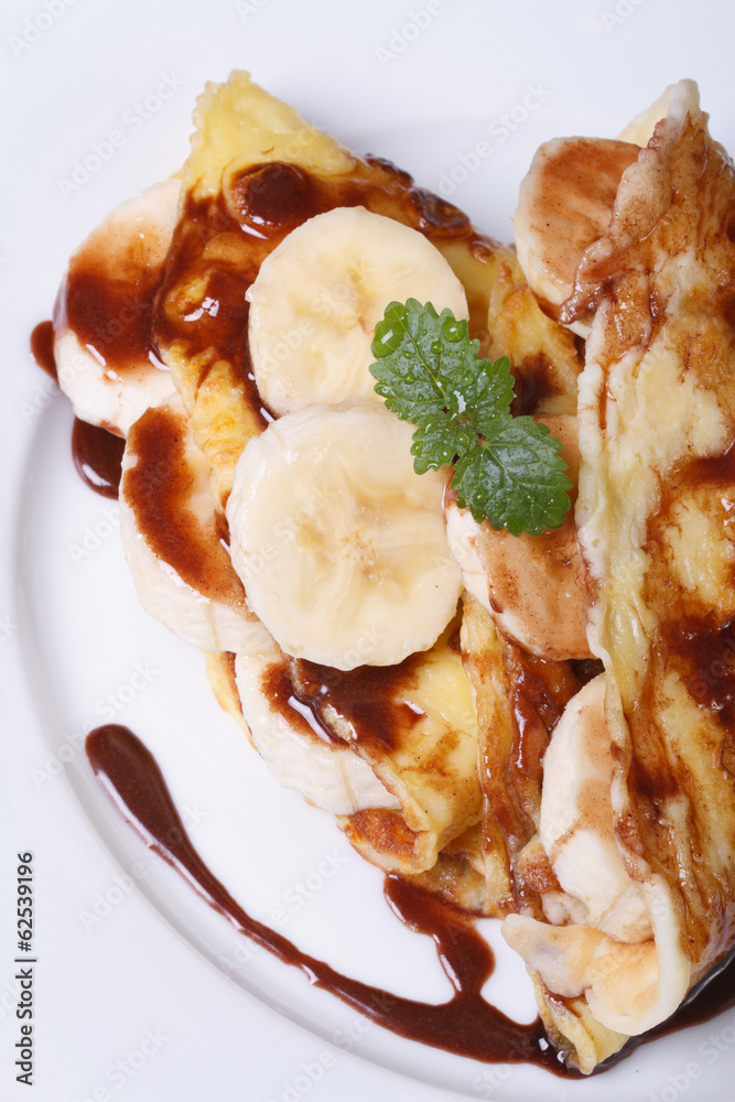 banana crepes with chocolate view from above. Vertical banana crepes with chocolate view from above. Vertical