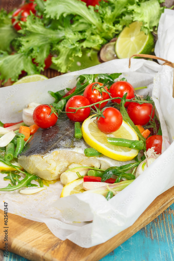 Cod with lemon and vegetables wrapped in baking parchment Cod with lemon and vegetables wrapped in baking parchment