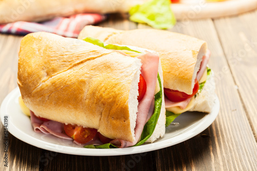 Italian panini sandwich with ham, cheese and tomato