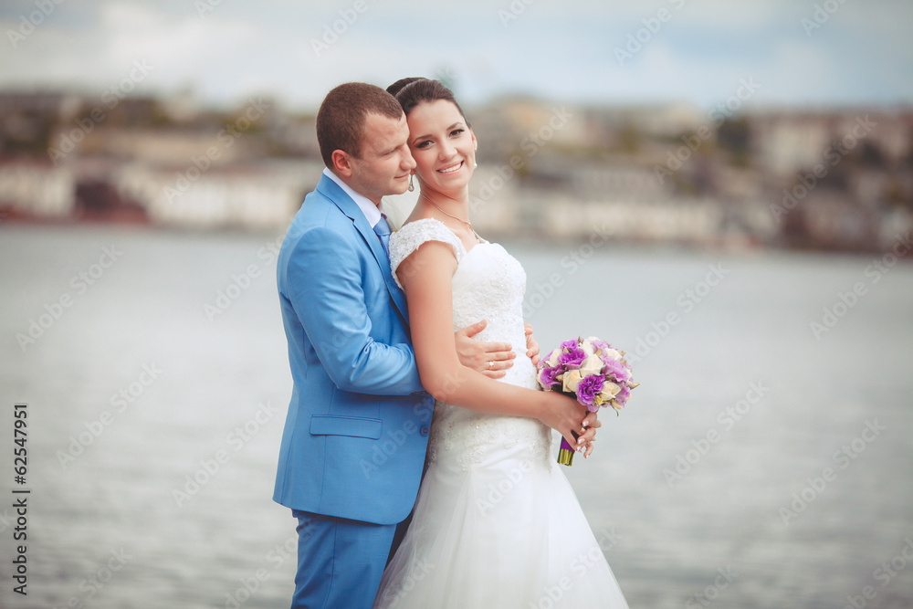 Bride and groom at wedding day kiss in park, retro grain Bride and groom at wedding day kiss in park, retro grain