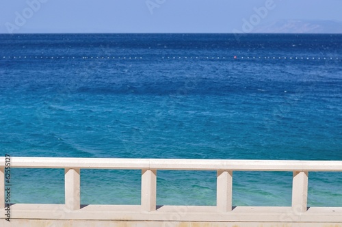 Blue adriatic sea with white banister in Podgora  Croatia