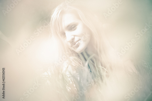 Fototapeta Naklejka Na Ścianę i Meble -  Toned blurred portrait of beautiful blonde woman