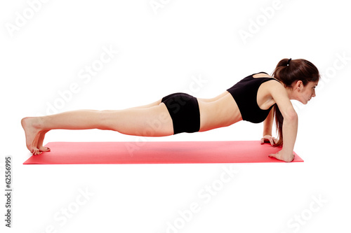 Athletic woman doing pushups