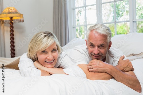 Portrait of a happy mature couple in bed