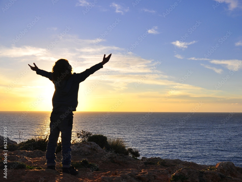 Boy hugging the sun Boy hugging the sun