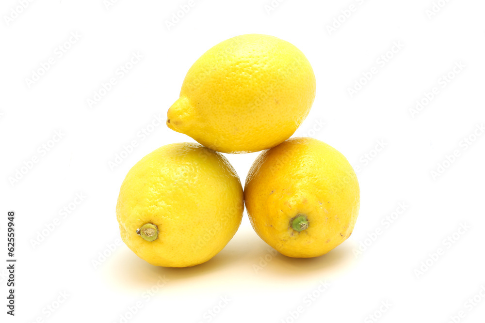 Bright lemons on a white background lie on each other Bright lemons on a white background lie on each other