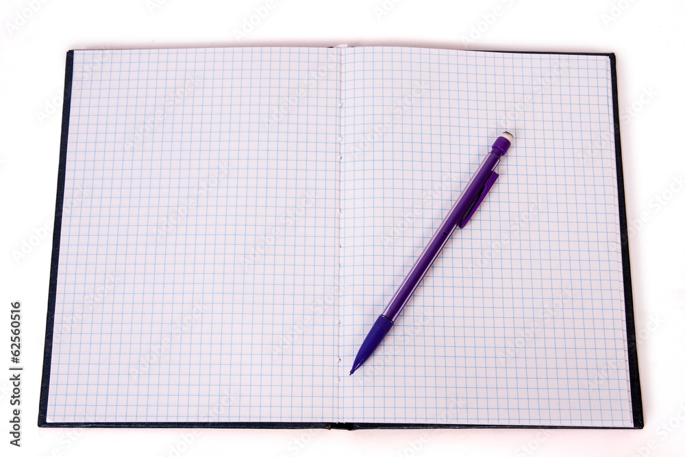pencil on checked notebook isolated on white background pencil on checked notebook isolated on white background