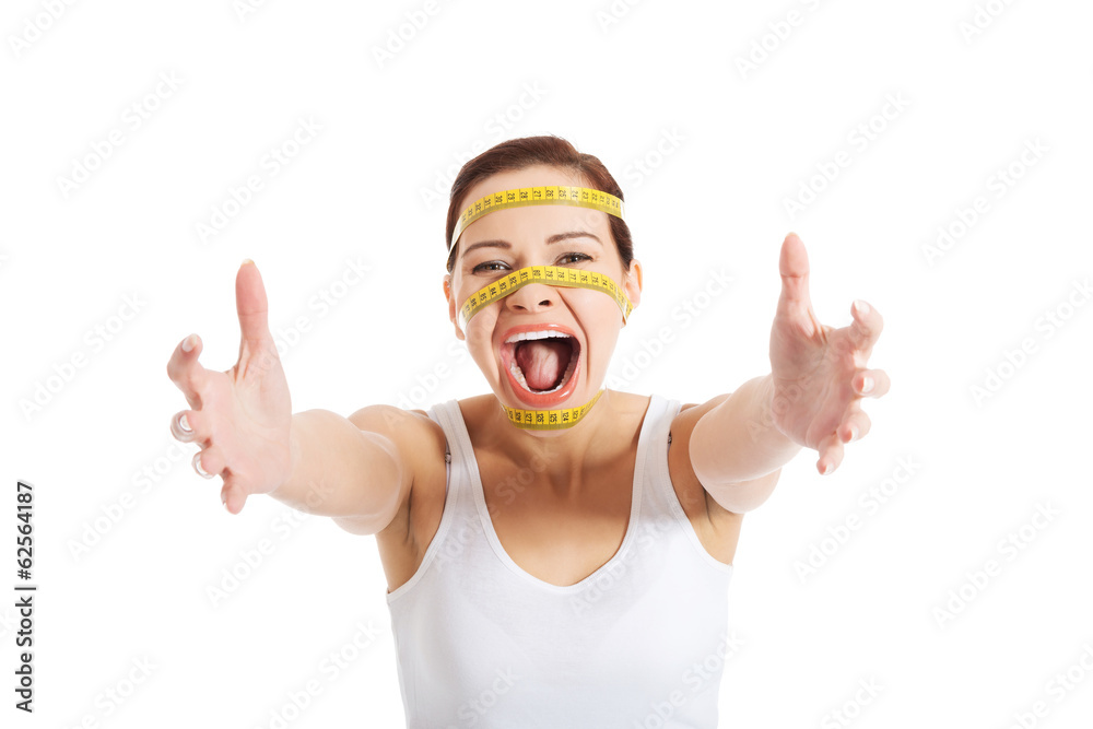 Woman's face with measuring tape Woman's face with measuring tape