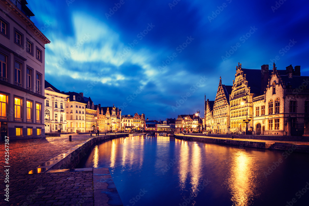 Ghent canal, Graslei and Korenlei streets in the evening. Ghent,