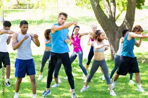 Friends exercising in park