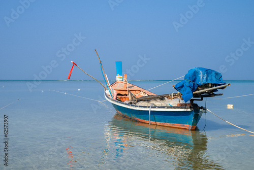 Traditional thai boats at  beach. photo
