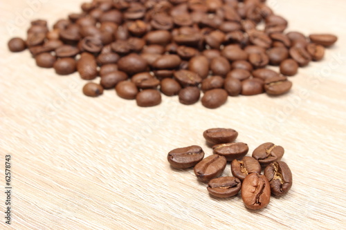 Heap of coffee on wooden background