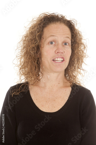 woman black shirt curly hair looking