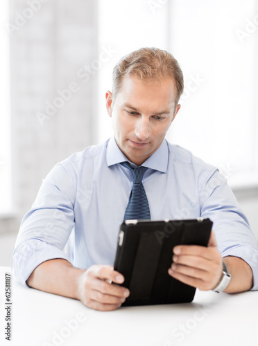 businessman with tablet pc in office