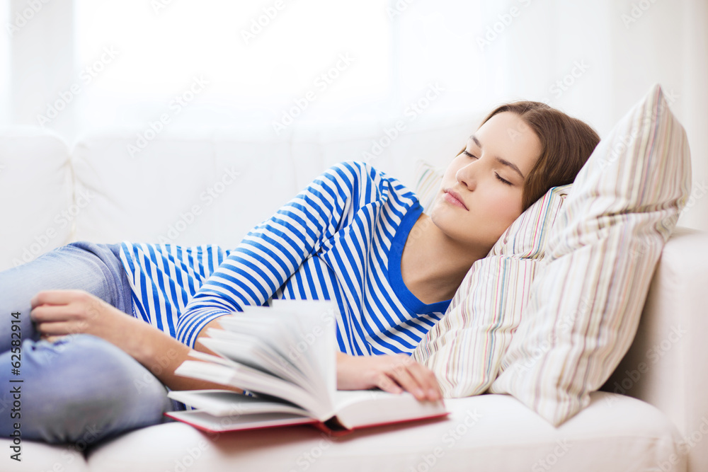 smiling teenage girl sleeping on sofa at home smiling teenage girl sleeping on sofa at home