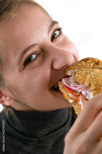 Young woman eating a sandwich
