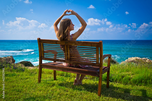 Young woman showing hands heart