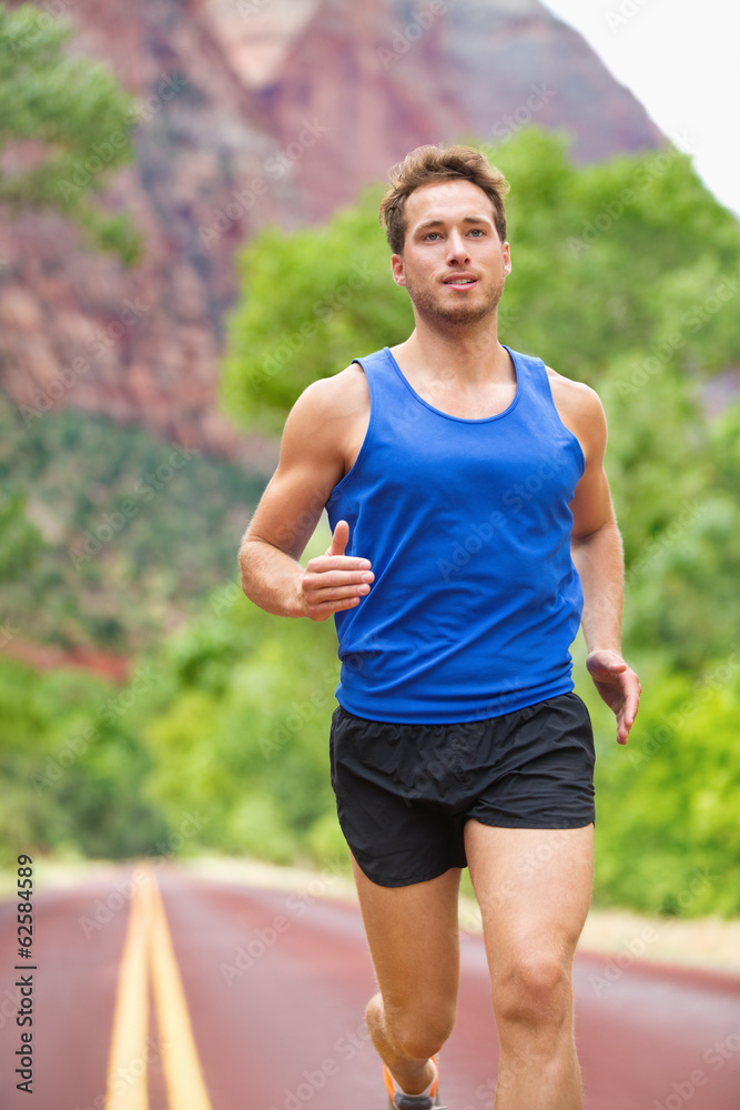 Athlete runner running on road Athlete runner running on road