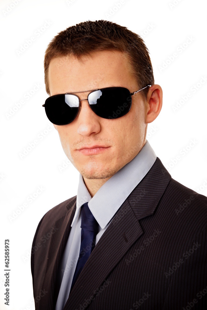 Portrait of young businessman at suit with sunglasses Portrait of young businessman at suit with sunglasses