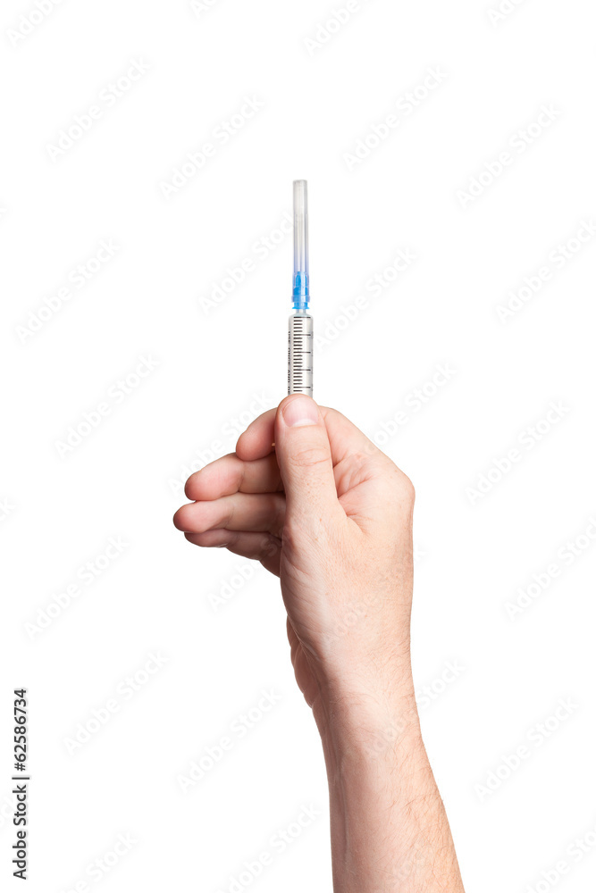 Hand holding syringe isolated on white background