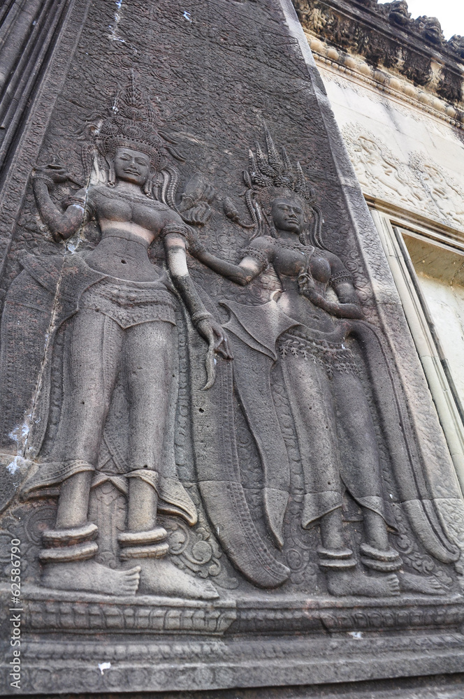 Dancing Apsaras an old Khmer art carvingsl in Angkor Wat