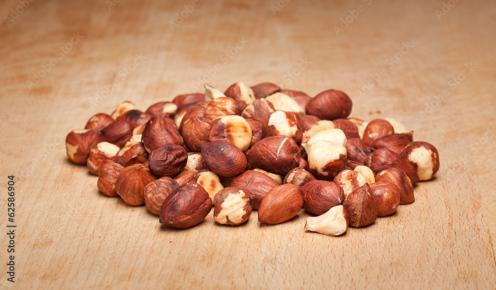 Fototapeta premium Hazelnuts on wooden background