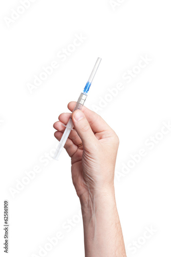 Hand holding syringe isolated on white background