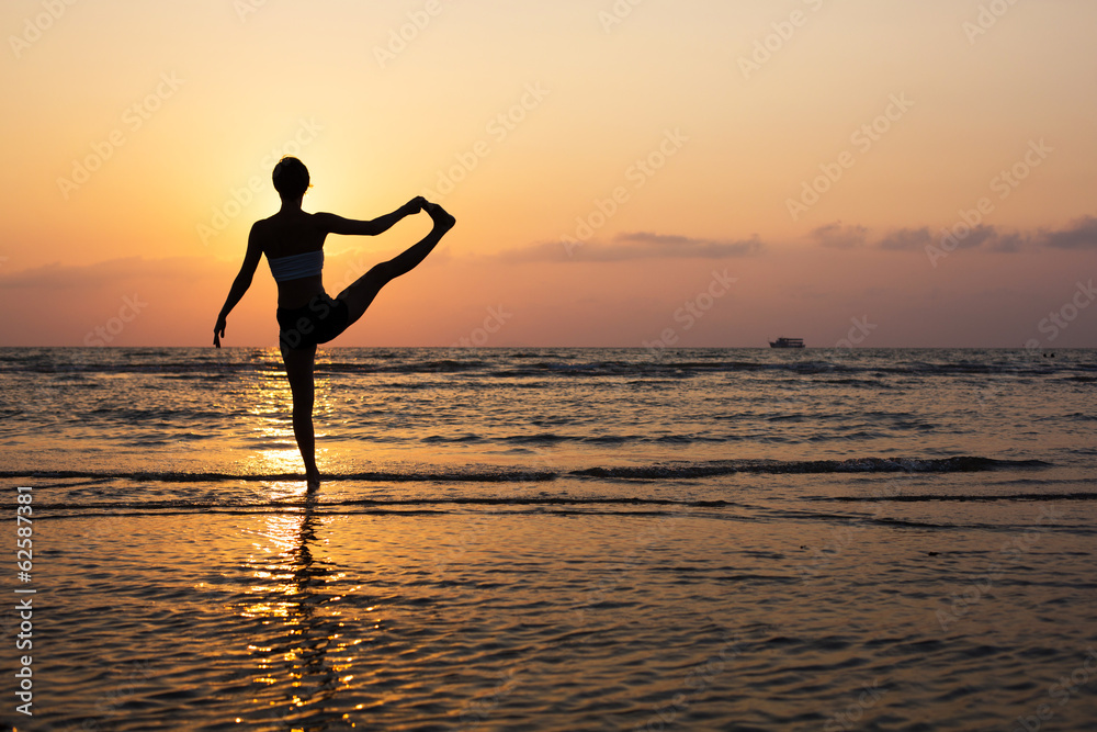 Yoga silhouette on the beach