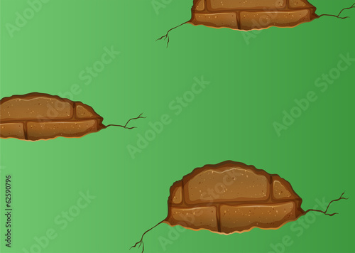 A green wall with cracks