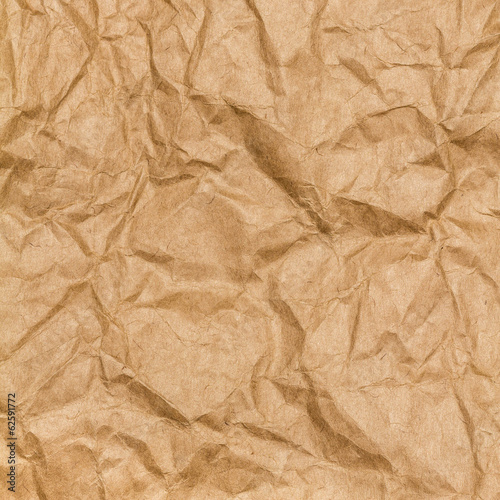 Crumpled paper texture background. Craft paper sheet, brown colo
