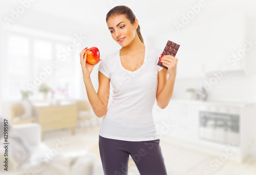 Young girl with chocolate and apple