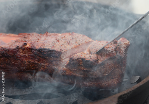 Smoked ham in the smokehouse