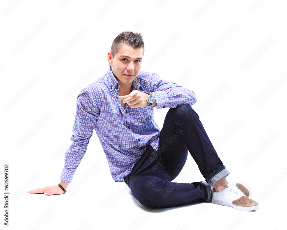 Flirtatious man sitting on the floor Flirtatious man sitting on the floor