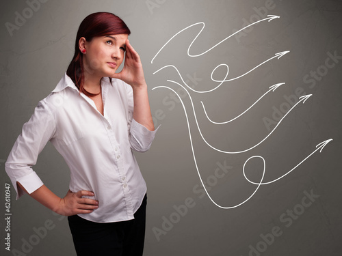 Attractive teenager looking at multiple curly arrows