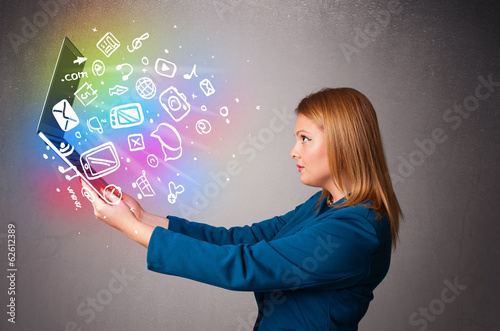 Young lady holding notebook with colorful hand drawn multimedia