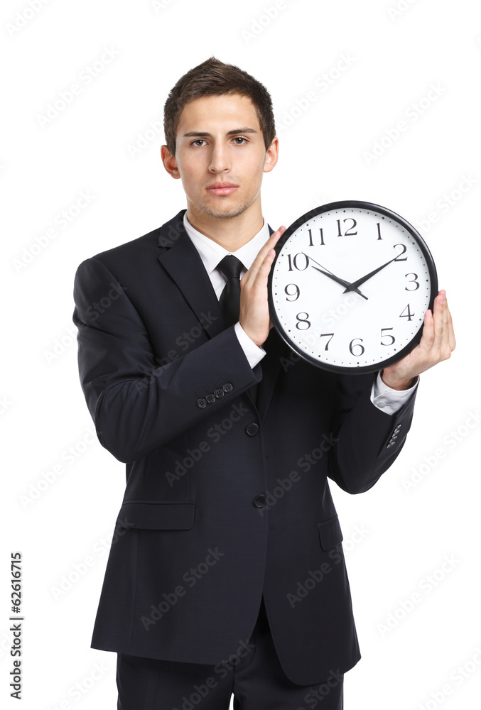 Half-length portrait of businessman holding clock Half-length portrait of businessman holding clock