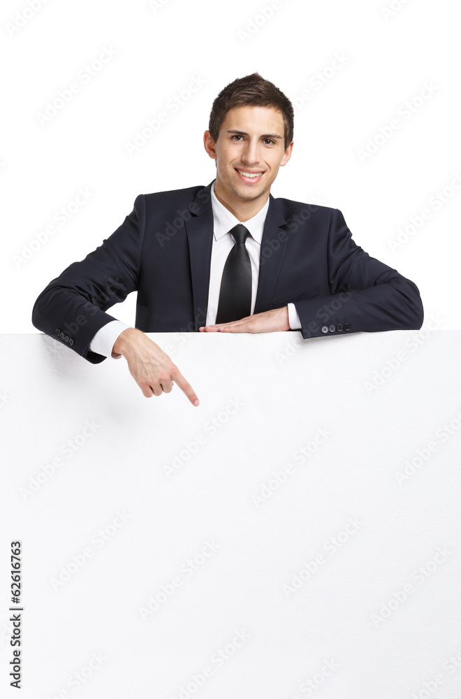 Businessman pointing hand gestures at copyspace Businessman pointing hand gestures at copyspace