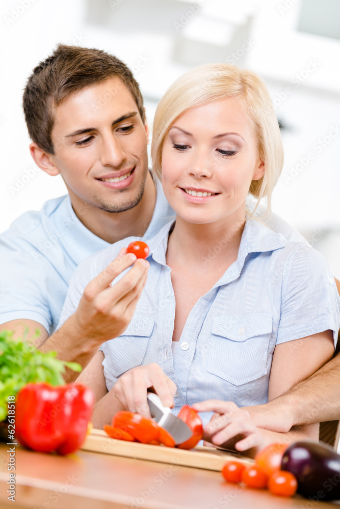 Young couple preparing breakfast sitting together