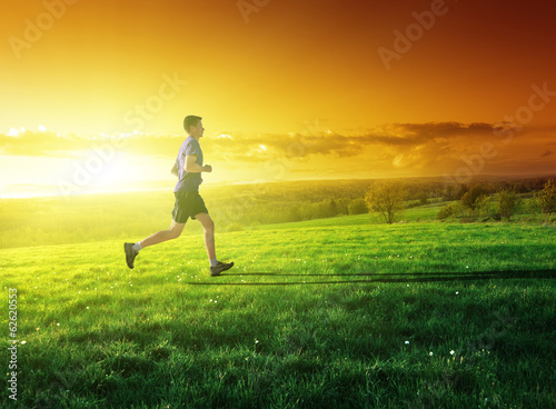 sunset and running young man